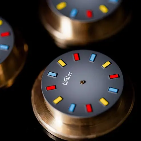 Close-up of vibrant, multicolored watch indexes