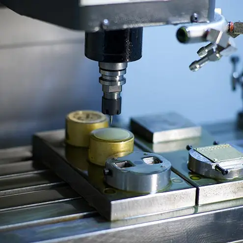 High-precision machinery operating on metal parts used in watch dial